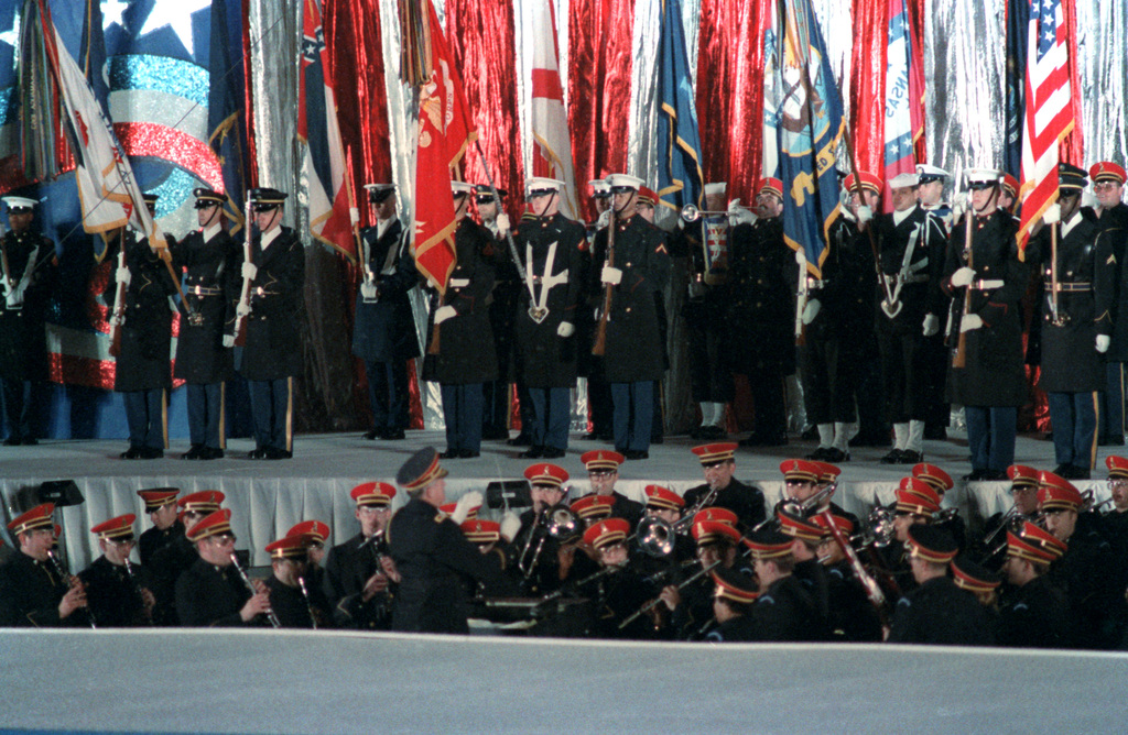 The color guard presents the flags for the National Anthem before