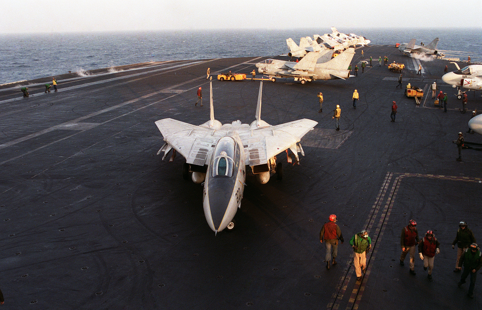 A Fighter Squadron 142 (VF-142) F-14A Tomcat taxis on the flight deck