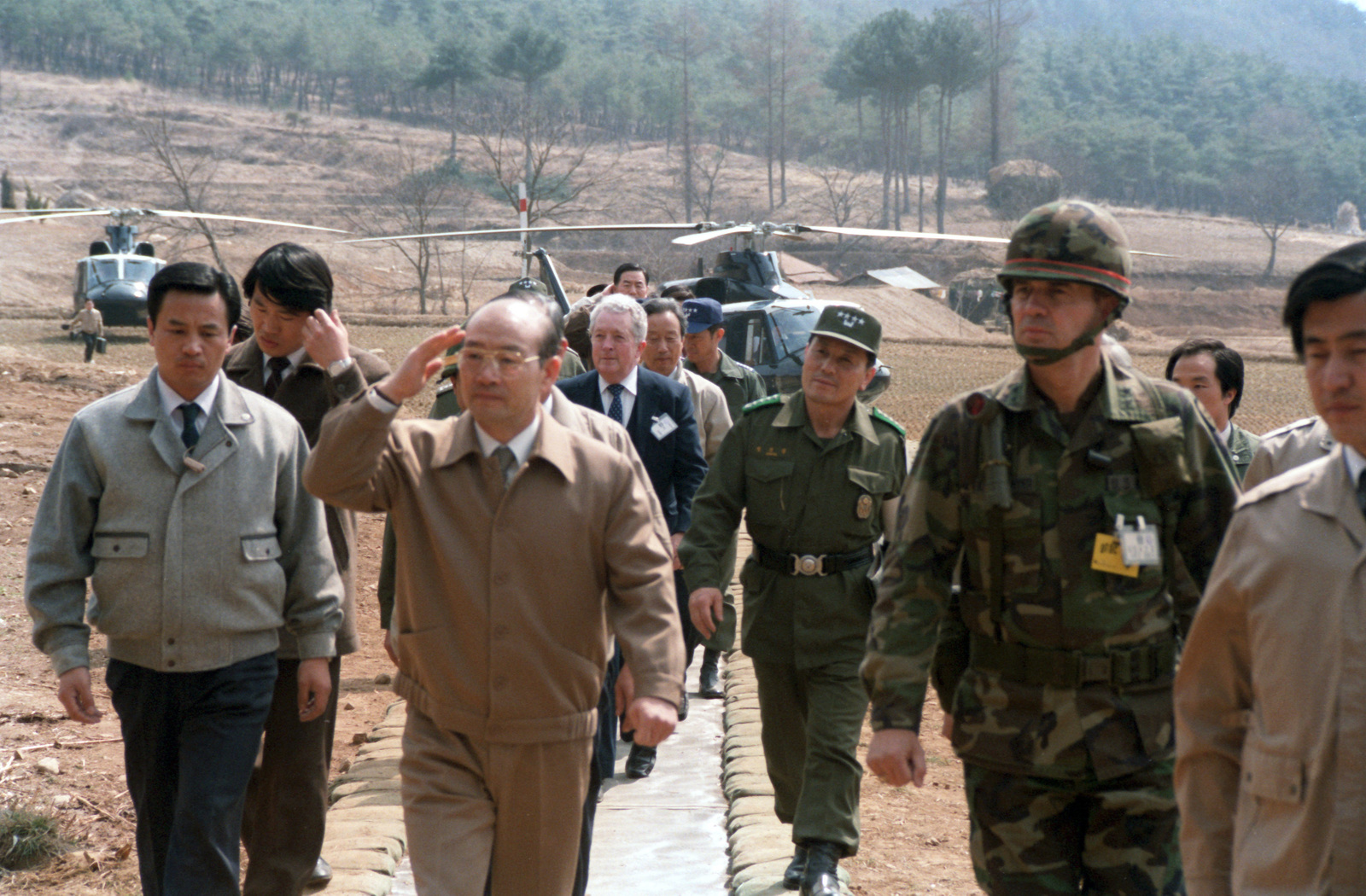 Korean President Chun Doo Hwan, Center, Is Escorted By Major General 