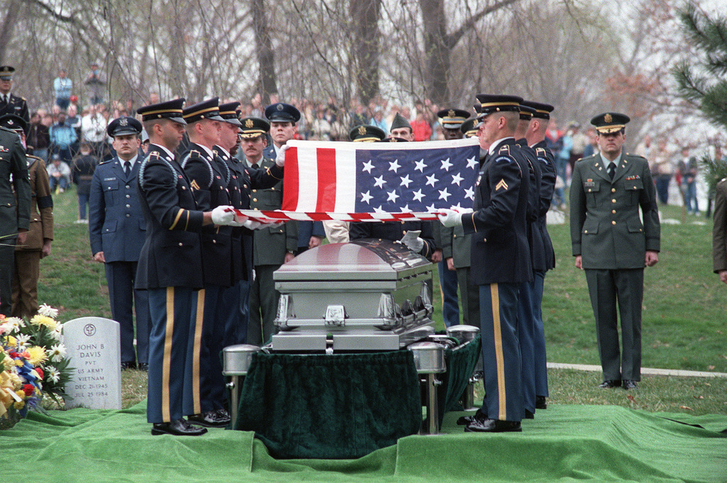 Members of the Army's 3rd Infantry (The Old Guard) fold the flag ...