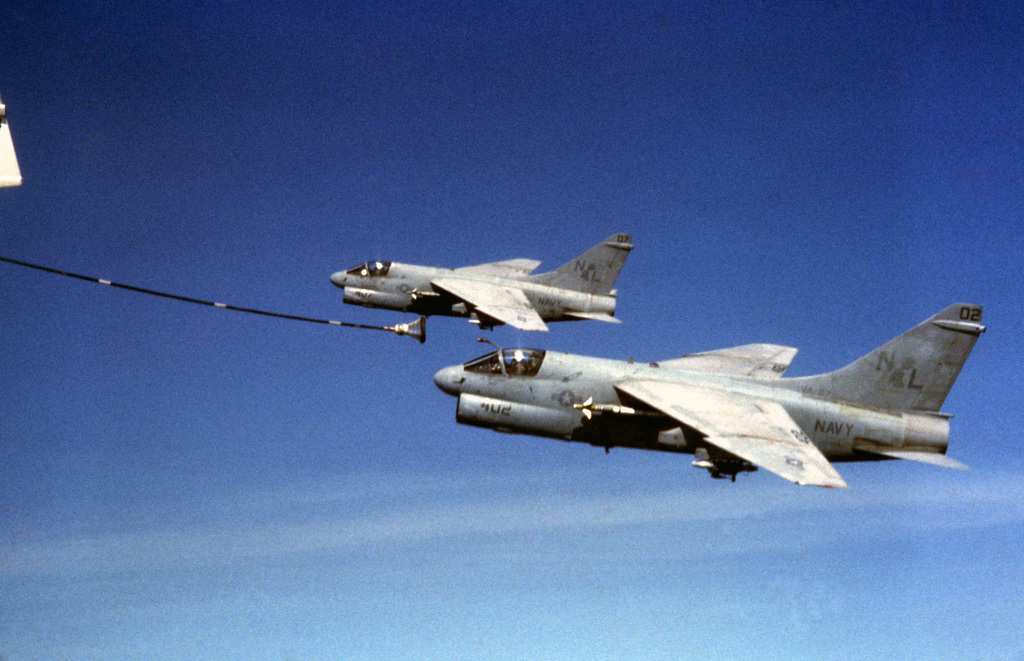 An air to air left side view of two A-7E Corsair II aircraft during an ...