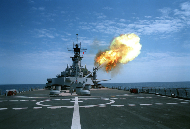 A round is fired from the No. 3 Mark 7 16-inch/50 caliber gun turret ...