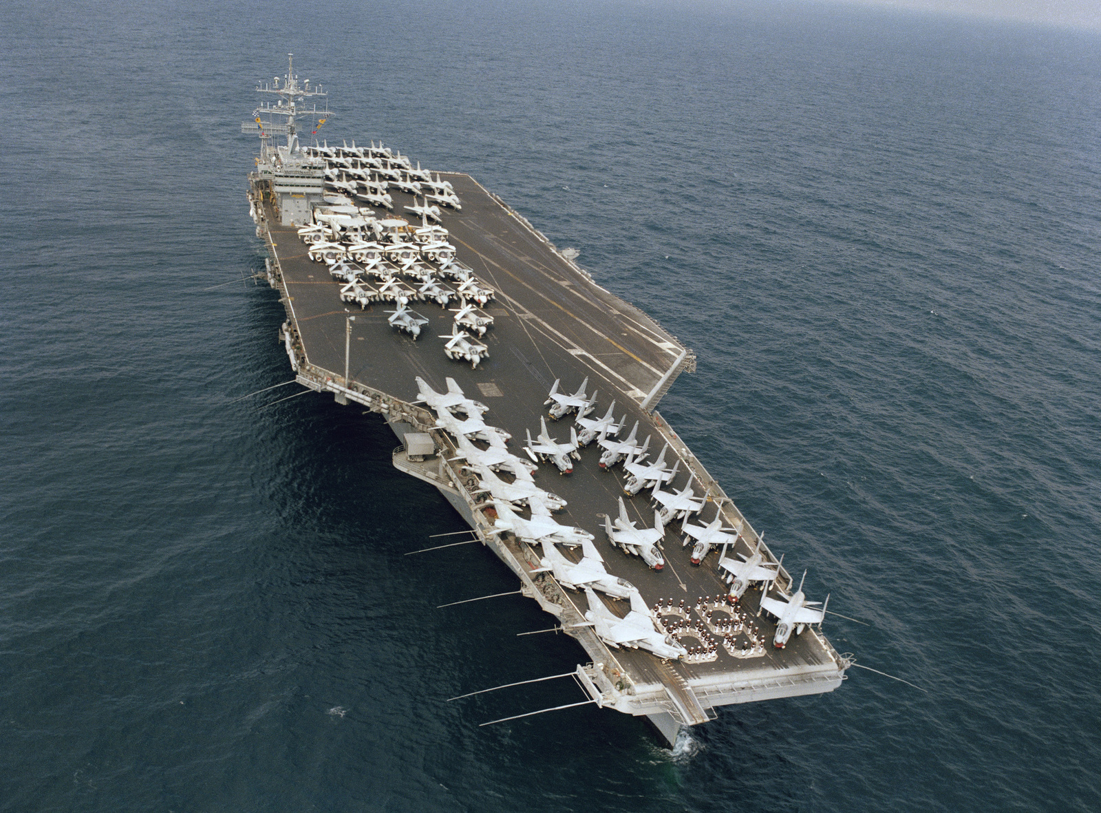 A starboard bow view of the nuclear-powered aircraft carrier USS DWIGHT ...