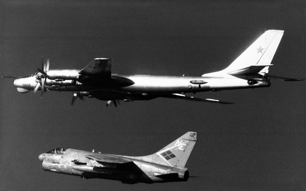 A left underside view of a Soviet Tu-95 Bear D aircraft in flight