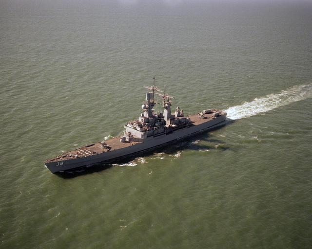 A port bow view of the nuclear-powered guided missile cruiser USS ...