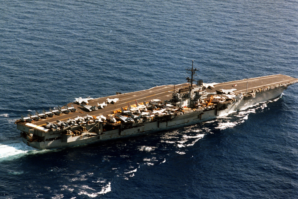 An elevated starboard quarter view of the aircraft carrier USS SARATOGA ...