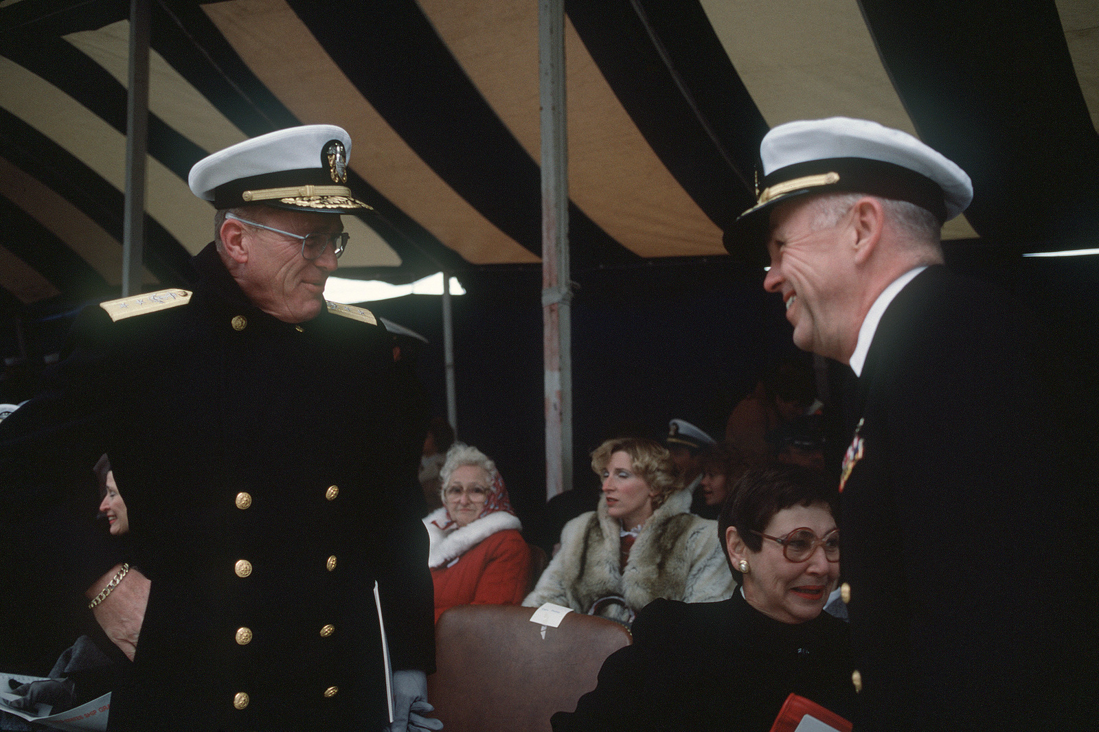 Two flag officers talk during the commissioning of the salvage ship USS ...