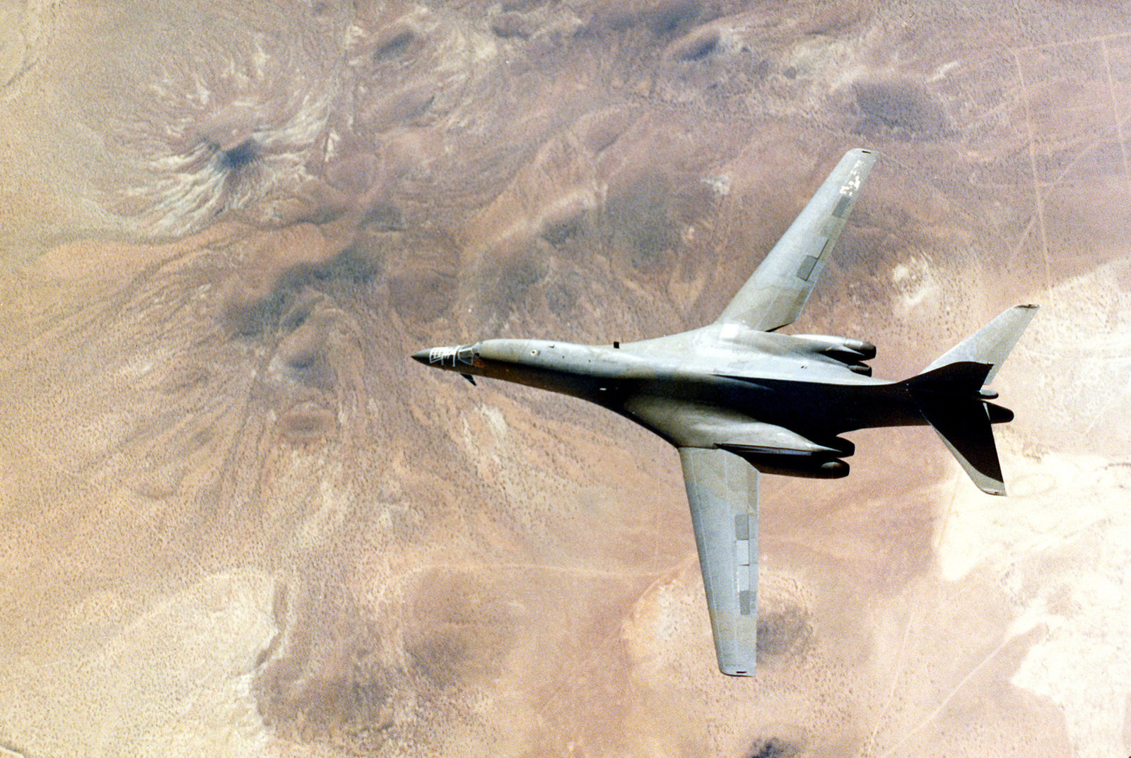 An Air-to-air Overhead View Of A B-1B Bomber Aircraft Aircraft Near ...