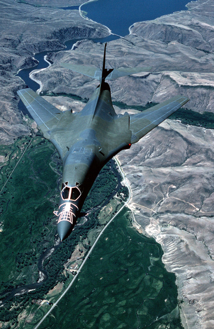 An air-to-air front view of the first operational B-1B bomber aircraft ...