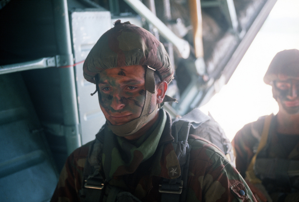 Members of the Italian 5th Paratrooper Battalion board a C-130E ...