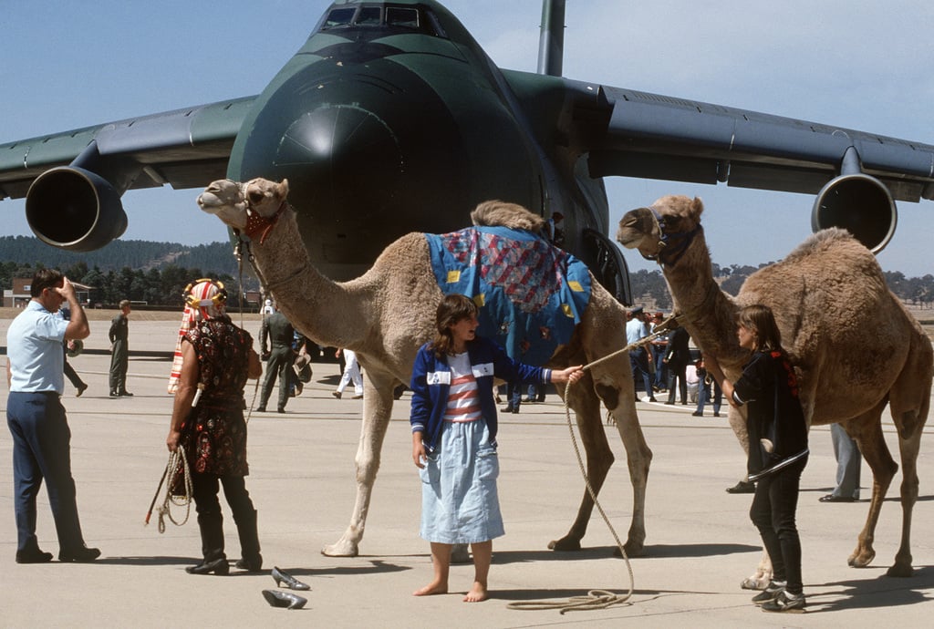 Circus members with camels welcome Australian troops upon their arrival