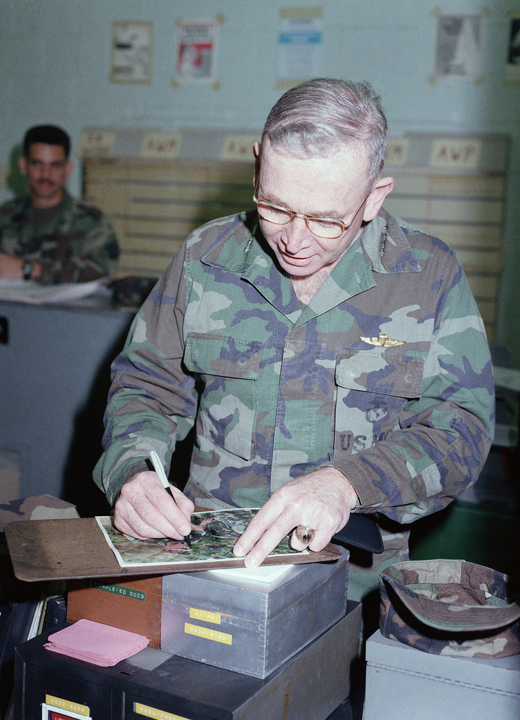 General Gen P X Kelley Commandant Of The Marine Corps Autographs A Portrait For A Marine From Headquarters And Maintenance Squadron 36 H Ms 36 During The General S Visit U S National Archives Public Domain Image