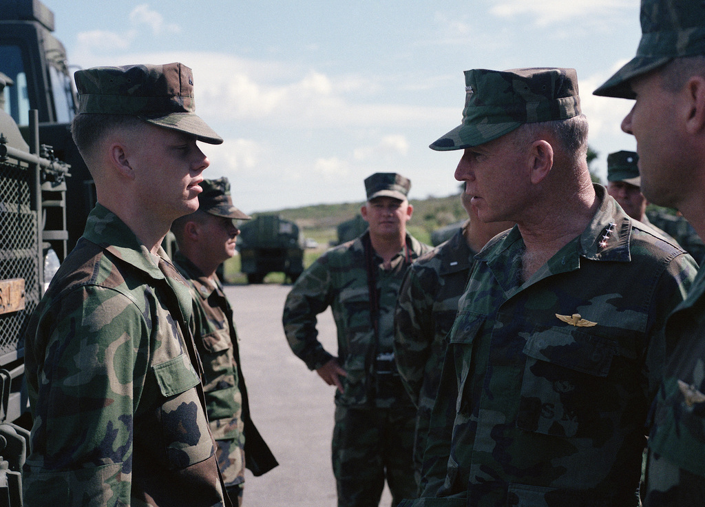 General Gen P X Kelley Commandant Of The Marine Corps Inspects Lance Corporal Lcpl Thomes Of Motor Transport Battalion Of Marine Wing Service Squadron 172 Mwss 172 During The General S Visit To The Base