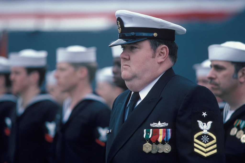 A Senior Chief Petty Officer Stands In Formation During The ...