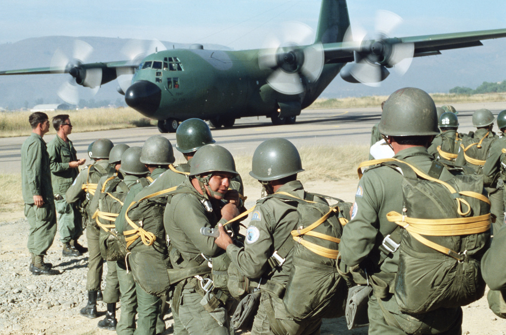 Bolivian paratrooper line up to board an aircraft during FUERZAS UNIDAS ...