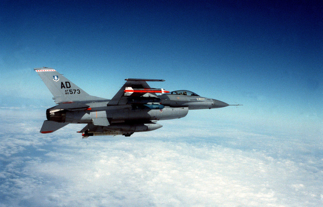 Shot of an F-16 Fighting Falcon aircraft armed with an AIM-9 Sidewinder ...