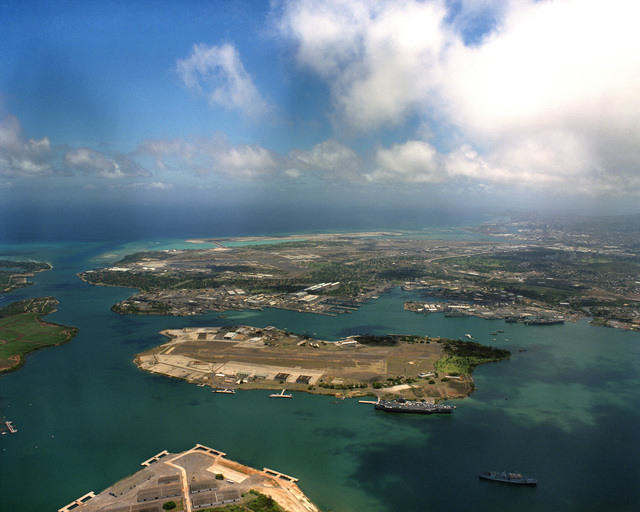 An aerial view of the naval base and Ford Island during Exercise RIMPAC ...