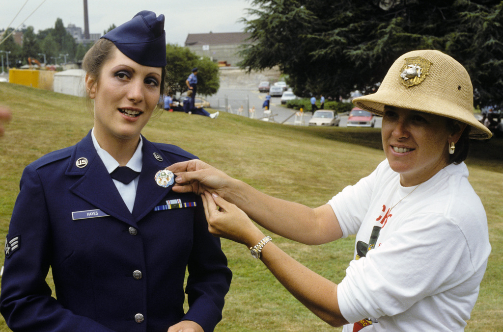 Sergeant (SGT) Susie L. Hayes receives a flight pin from Kim S. Thomas ...