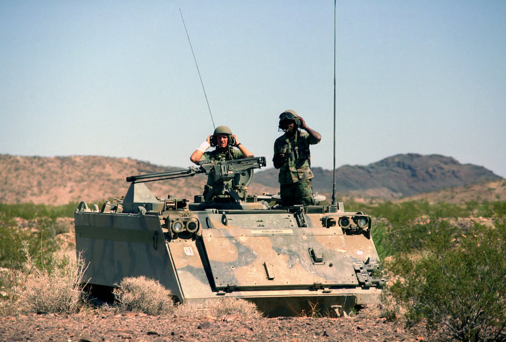 Members of the 197th Infantry Brigade (Mechanized) look out from the ...