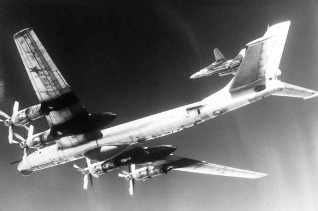 A left underside view of a Soviet Tu-95 Bear D aircraft in flight