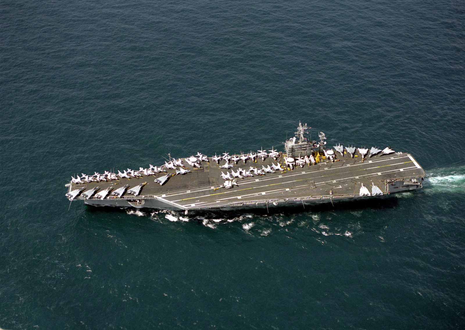 An elevated port view of the nuclear-powered aircraft carrier USS CARL ...