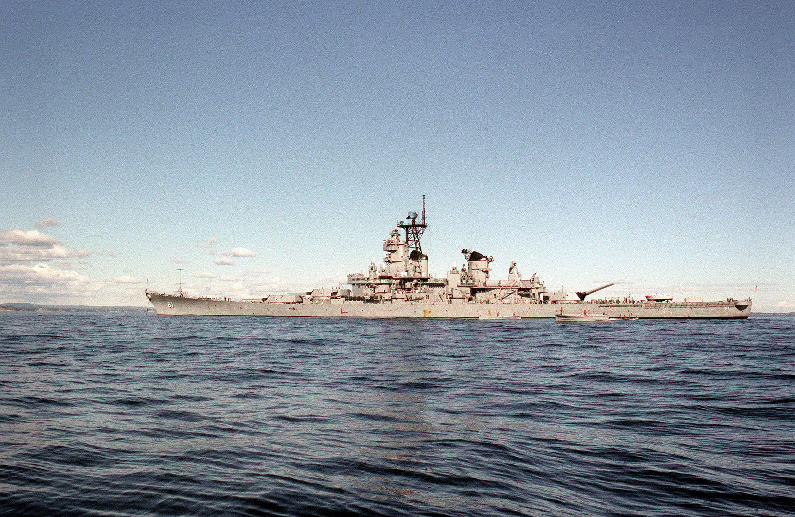 A port beam view of the battleship USS IOWA (BB-61) anchored off the ...