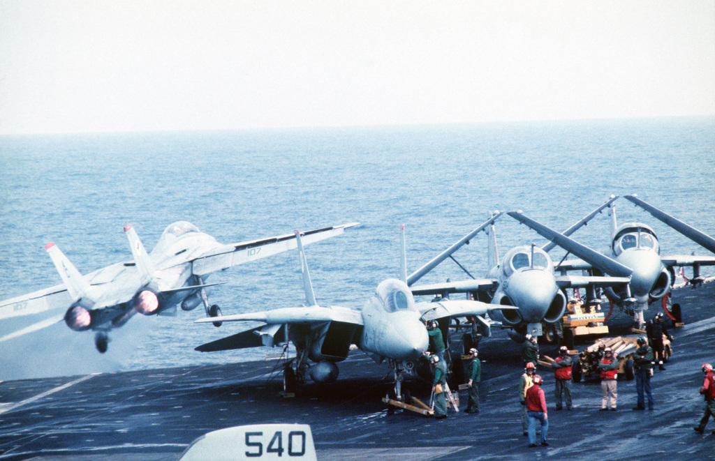 An F-14A Tomcat aircraft is launched from the aircraft carrier USS JOHN ...