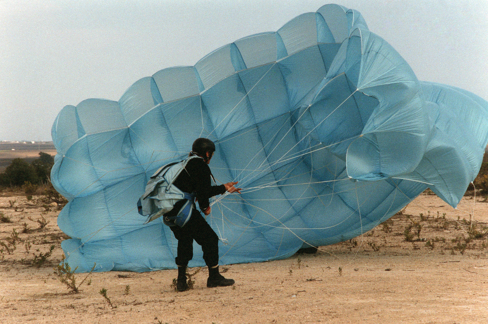 A Member Of The Explosive Ordnance Disposal (EOD) Team Gathers Up His ...