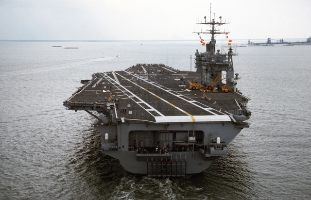 A stern view of the nuclear-powered aircraft carrier USS THEODORE ...