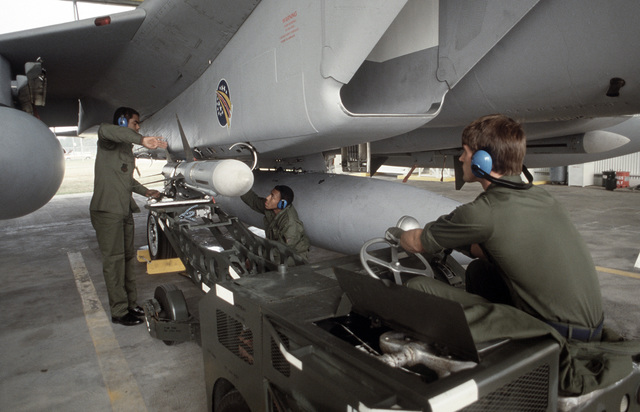 Technicians of the 48th Fighter Interceptor Squadron use a MJ-1 bomb ...