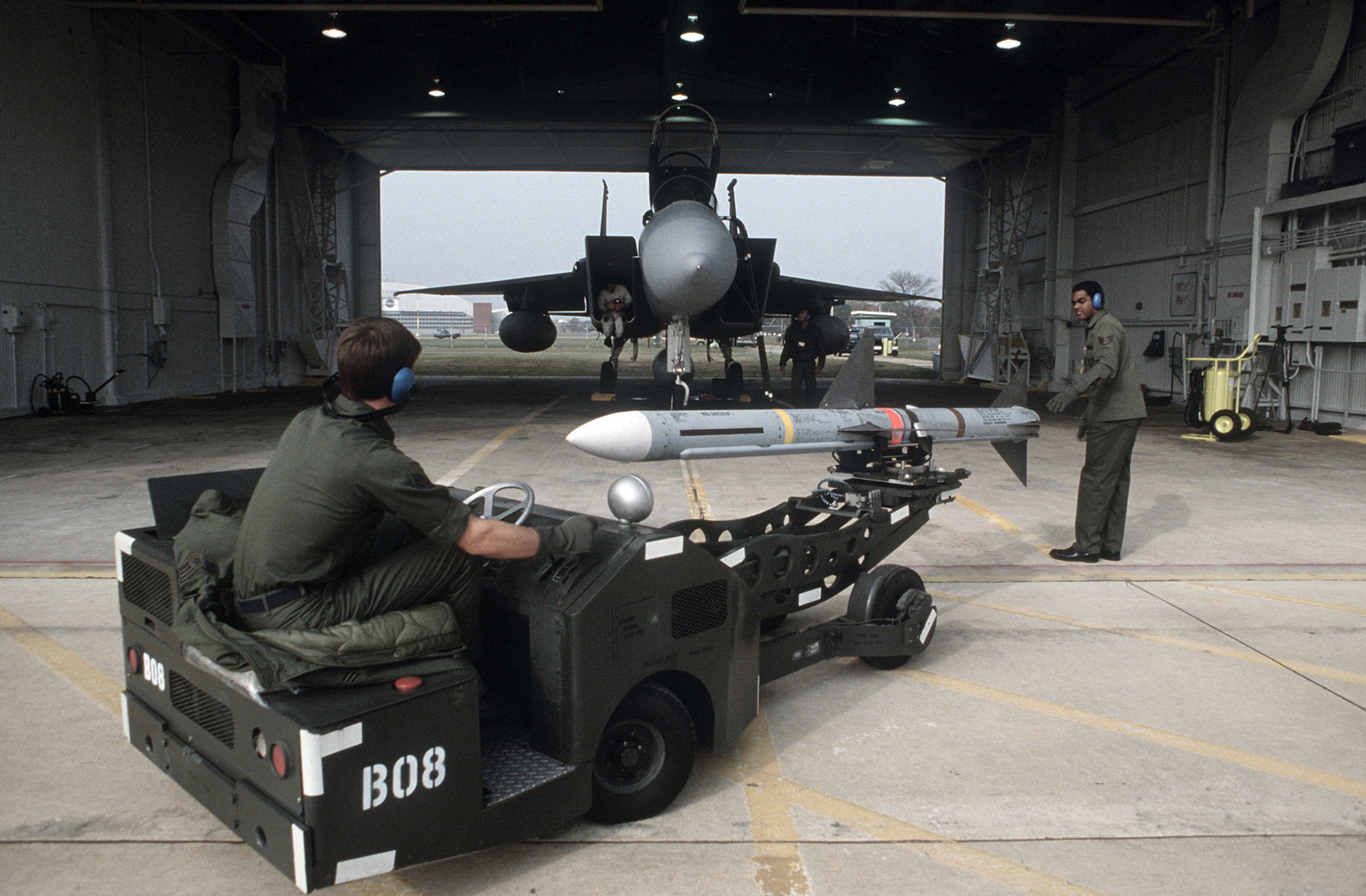 Technicians of the 48th Fighter Interceptor Squadron use a MJ-1 bomb ...