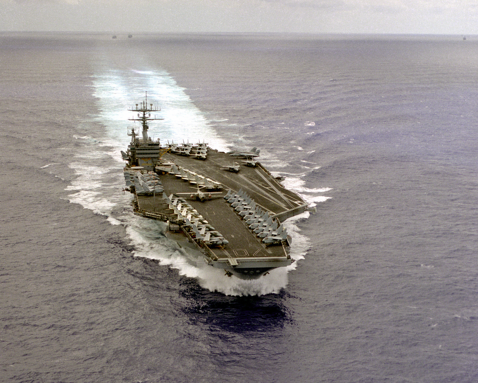 An aerial starboard bow view of the nuclear-powered aircraft carrier ...