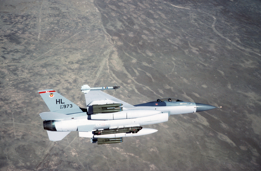 An Air-to-air Right Side View Of An F-16 Fighting Falcon Aircraft Of ...