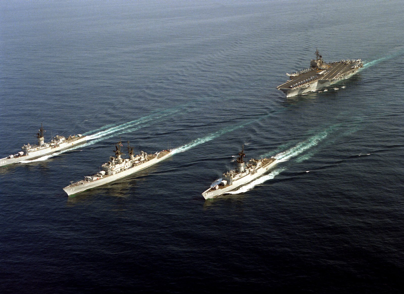 An aerial port bow view of various U.S. Navy ships of the aircraft ...