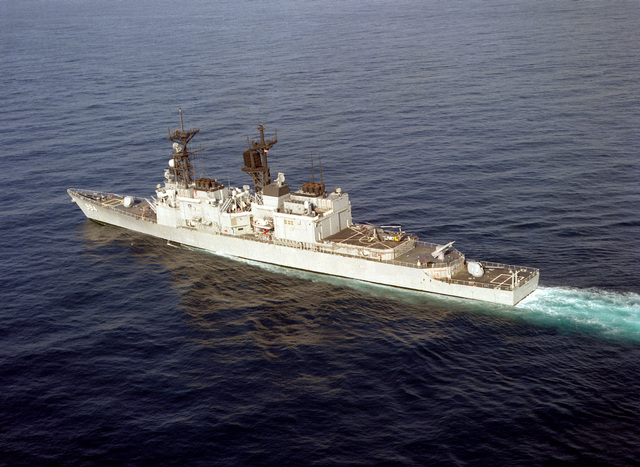 An aerial port quarter view of the guided missile destroyer USS ...