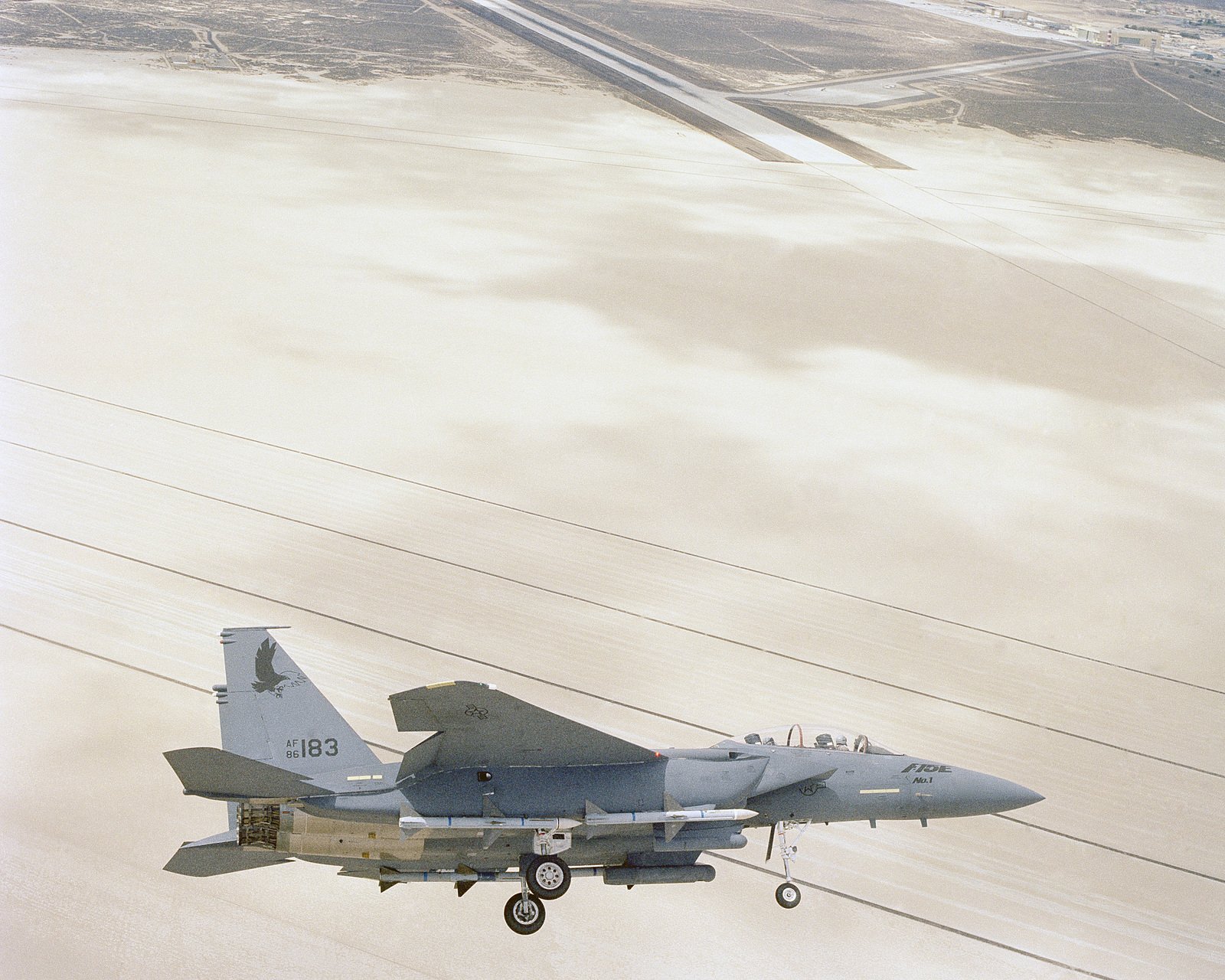 An F 15e Eagle Aircraft Armed With Aim 7 Sparrow Missiles Comes In For A Landing During Flight Evaluations Nara Dvids Public Domain Archive Public Domain Search