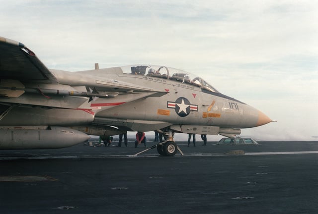 A Fighter Squadron 143 (VF-143) F-14A Tomcat Aircraft Armed With An AIM ...