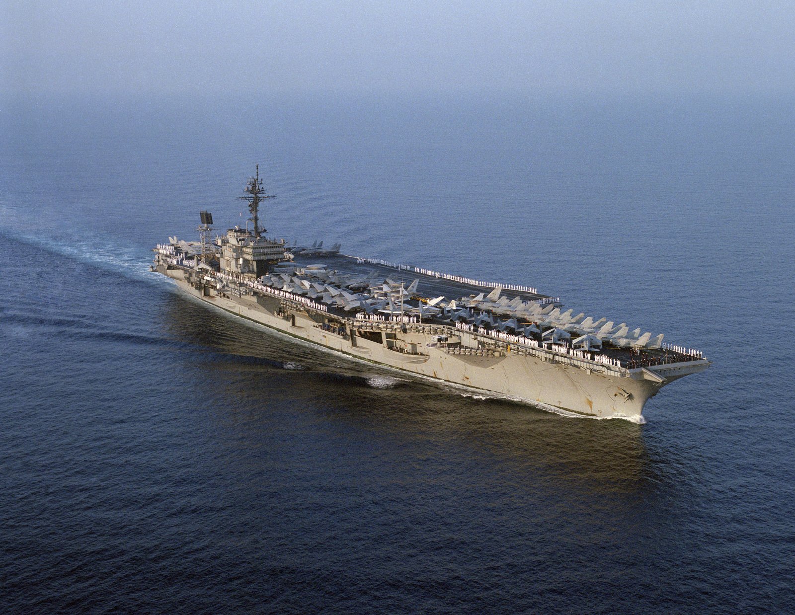 An aerial starboard bow view of the aircraft carrier USS KITTY HAWK (CV ...