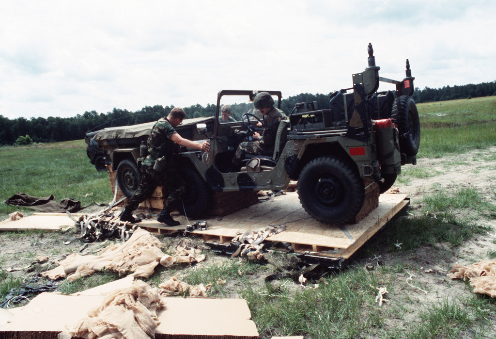 Members Of The 1ST Battalion 39th Field Artillery Remove An M151 Light ...