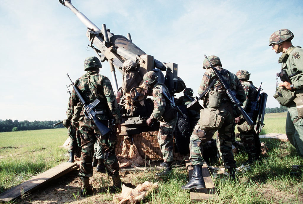 Members Of The 1ST Battalion, 39th Field Artillery Work Together To ...