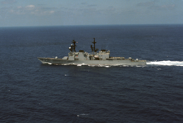 An aerial port beam view of the destroyer USS COMTE DE GRASSE (DD 974 ...