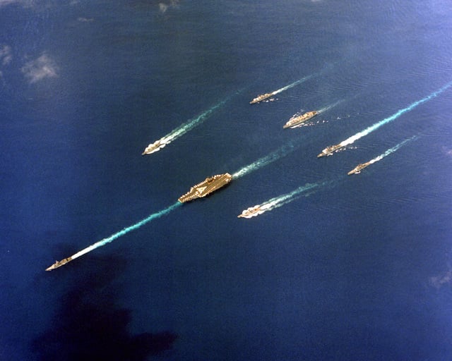 An aerial view of the aircraft carrier USS CONSTELLATION (CV-64) battle ...