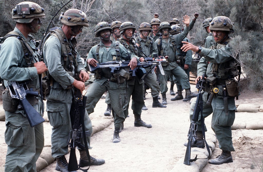 A troop leader of the 5th Battalion, 87th Infantry Brigade, goes over ...