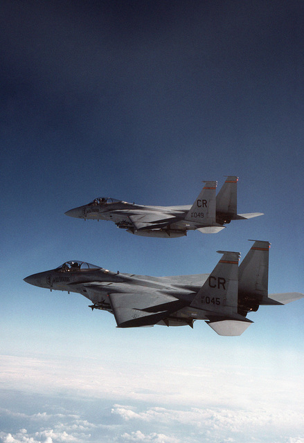 An air-to-air left side view of two 32nd Tactical Fighter Squadron (TFS ...