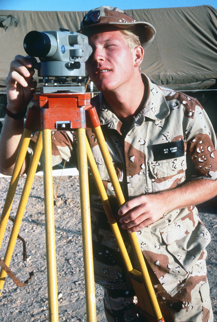 AIRMAN (AMN) First Class Mark Starr, a surveyor with the 823rd Civil ...