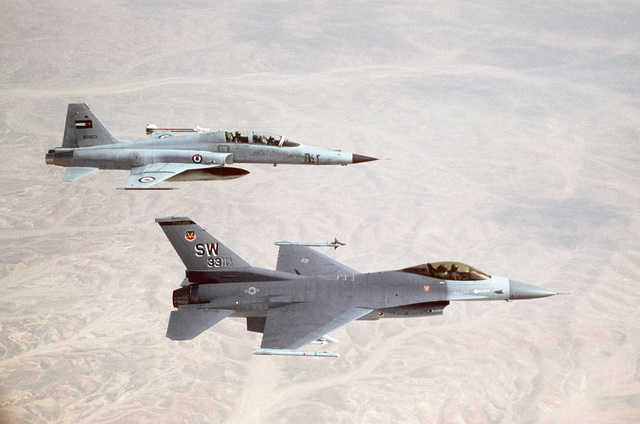 An air-to-air right side view of a 33rd Tactical Fighter Squadron F-16C ...