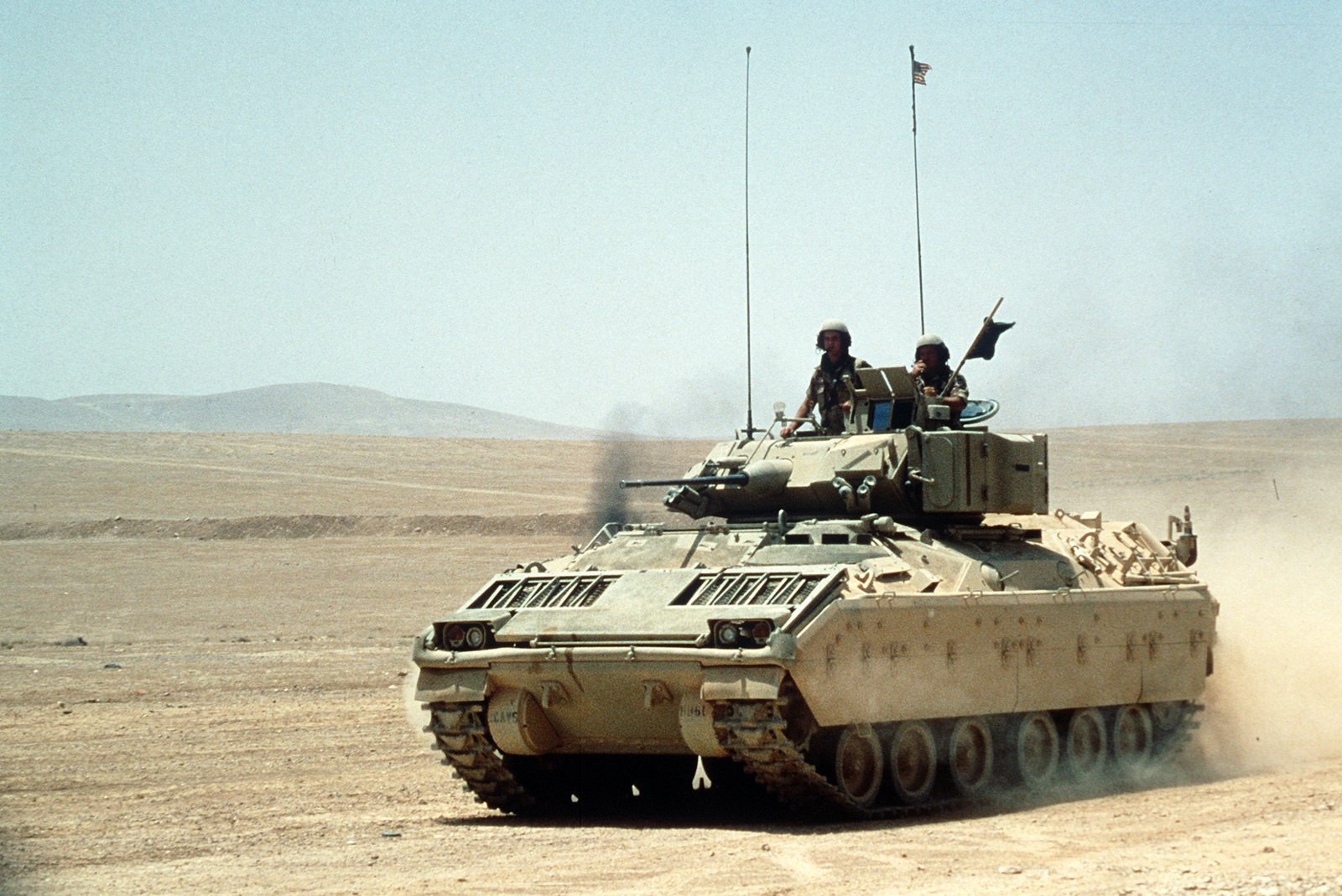 An M-2 Bradley infantry fighting vehicle maneuvers in the desert during ...