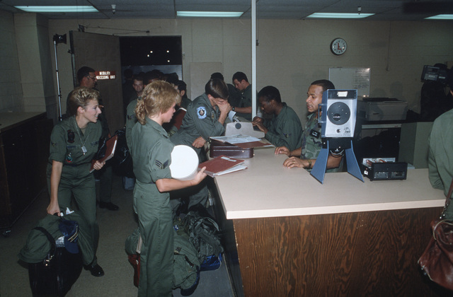 Members of the 430th Tactical Fighter Squadron move through the ...