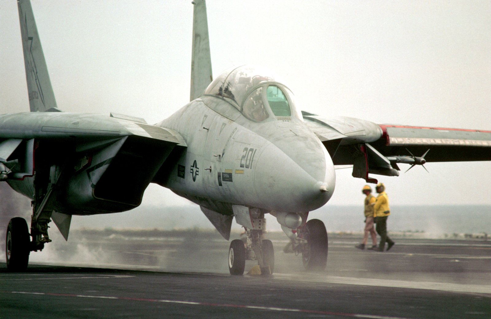 A Fighter Squadron 33 (VF-33) F-14A Tomcat aircraft is launched from ...