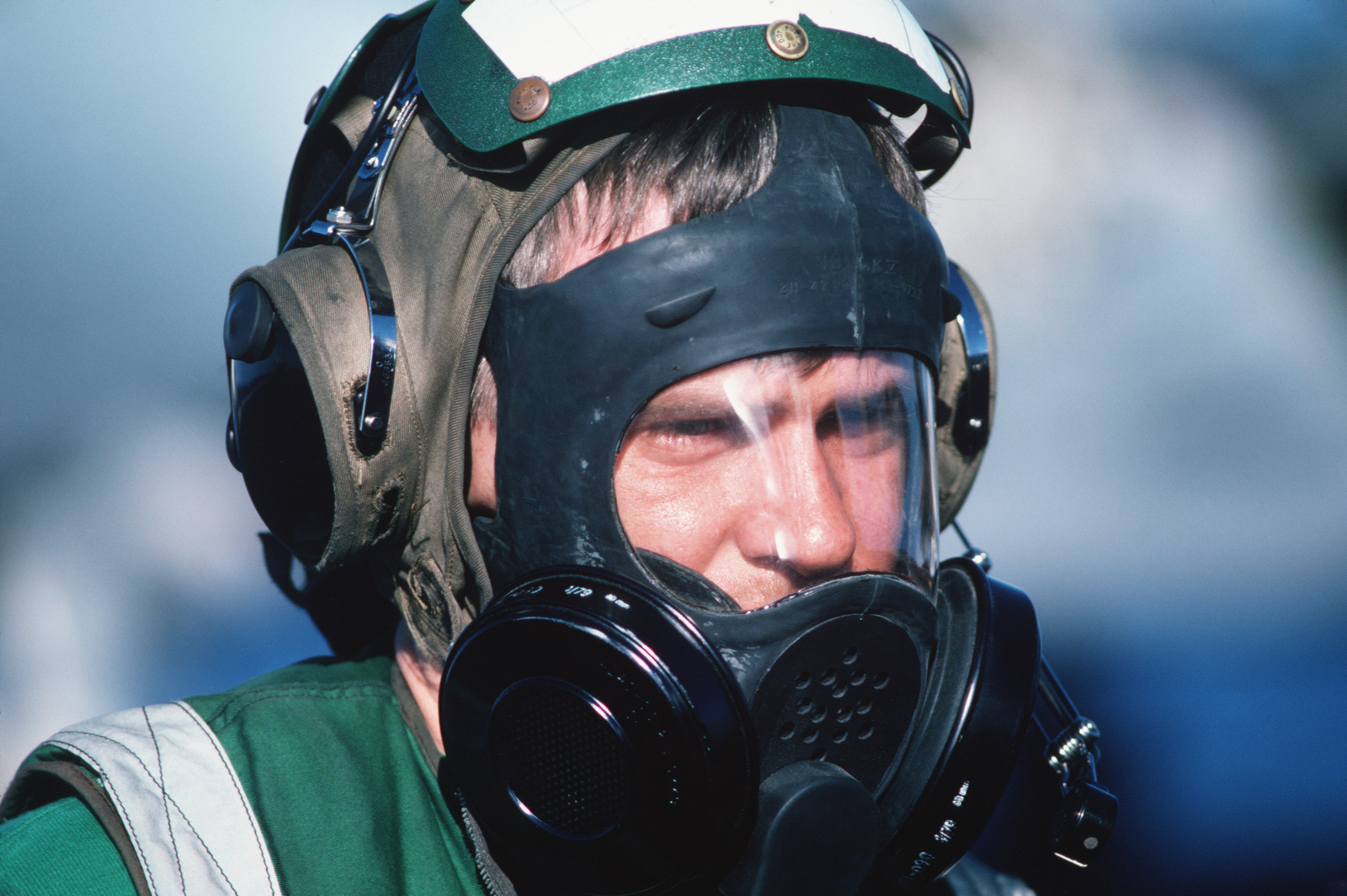 A Flight Deck Crewman Wears An Nd Mark V Nuclear Biological And Chemical Mask During A General 